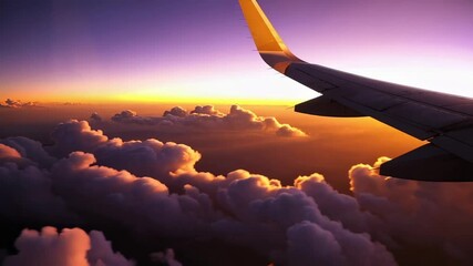 Aufkleber - Golden hour sunrise illuminates airplane wing soaring above a breathtaking cloudscape, creating a mesmerizing slow motion spectacle of color and tranquility