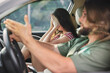 © SHOTPRIME STUDIO - Frustrated couple in a car during a disagreement, showing tension and emotional strain