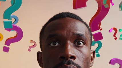 Aufkleber - Multiple images of a pensive man's face, surrounded by colorful floating question marks against a light brown background, symbolizing decision making and problem solving