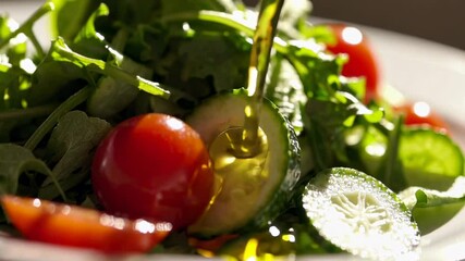 Poster - Golden oil is poured onto a fresh salad composed of arugula, cherry tomatoes, and cucumber slices in a slow motion sequence, emphasizing the healthy and appetizing nature of the dish