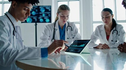 Aufkleber - Diverse medical professionals collaborate, examining data on a tablet, discussing diagnoses and treatment plans in a modern hospital setting, captured in slow motion