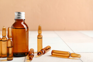 Poster - Medical ampules, bottle and syringe on white tile table