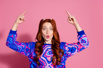 Wall Mural - Photo portrait of lovely young lady amazed point up empty space dressed stylish blue colorful garment isolated on pink color background