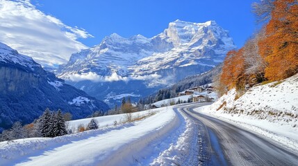 Poster - A stunning capture of a mountain road cutting through a snowy landscape, with snow-capped peaks rising majestically in the background, creating a winter wonderland.