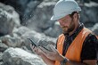 © alva studio - Quarry Worker Examining Rock Sample Using Smartphone