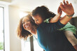 © peopleimages.com - Happy, mother and child for playing of flying game with fantasy fun, imagination airplane and bonding together. Woman, girl and family security for balance support, love connection and trust at house