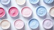 © pinporn manosri - Frozen ice cream tubs with frost-covered lids, arranged on a white marble background with a spacious copy space.