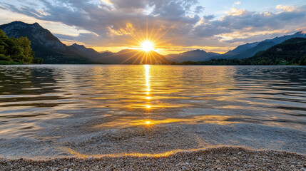 Wall Mural - serene sunrise over glassy lake, reflecting warm hues and mountains