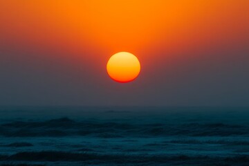 Wall Mural - Stunning vibrant sunset over calm ocean horizon with deep hues
