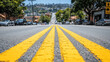 © OptunaMeta - Urban street perspective with bold yellow road markings leading toward a distant cityscape, symbolizing travel, exploration, and modern city life