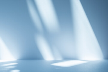 Fototapete - Wall interior background, studio and backdrops show products. with soft light shadow from window color blue and white. background for text insertion and presentation of product	