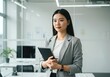 © Raditya Pawitra  - the figure of a great woman who works in the office with a firm and dignified face. office room background Ai generative