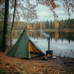 camping tent on the bank of the lake in autumn forest.