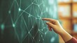 © Atmospheric stock - Hand pointing at abstract network diagram on chalkboard