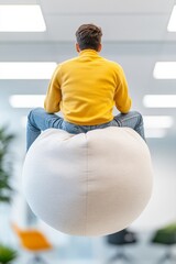Poster - Playful Office Vibes Young Professional in Bright Casual Attire Climbing Soft Bean Bag Workplace Relaxation and Team Building in Modern Corporate Culture