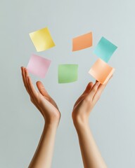 Poster - Minimalist Office Play Faceless Hands Tossing Colorful Sticky Notes in Natural Light - Creative Workspace Engagement and Stress Relief for Modern Professional Settings