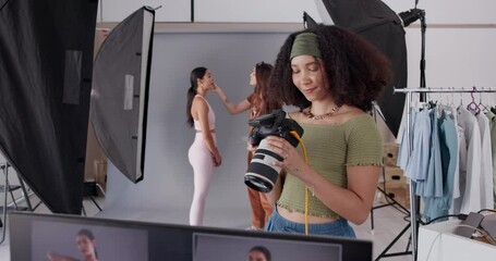 Poster - Happy woman, photographer and set with camera for production, film or photography at studio. Female person, technology and lighting with stylist, makeup artist or model for professional photoshoot