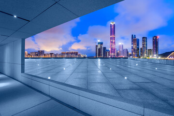 Wall Mural - View through the square platform to see colorful modern city buildings at night