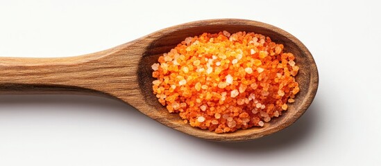 Aufkleber - Vibrant orange sea salt nestled in a wooden spoon on a white background highlighting its texture and rich color with a natural wooden finish