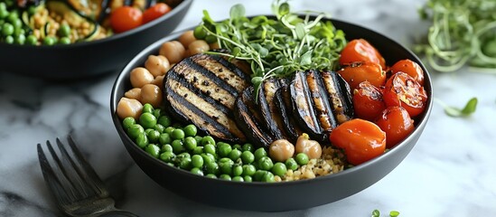 Poster - Healthy gourmet bowl featuring grilled eggplant slices, cherry tomatoes, chickpeas, peas, and fresh greens arranged in a black bowl on marble background.