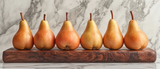 Poster - Vibrant pear arrangement on a wooden cutting board centered against a light marble backdrop with smooth textures and warm earthy colors.