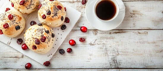 Poster - Freshly baked cranberry scones arranged on a white plate with scattered cranberries beside a black coffee cup on a rustic wooden table