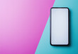 © AnggalihPs - Smartphone with white blank screen for mockup or copy space. Isolated on purple, pink, blue background