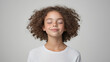 © kazakova0684 - A studio portrait of a girl exuding serenity, her eyes closed and a peaceful smile on her lips