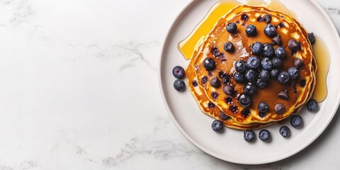 Poster - Delicious golden pancakes topped with dark chocolate chips and fresh blueberries drizzled with golden honey on a light marble background.
