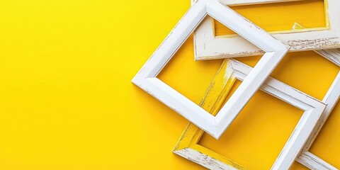 Poster - empty white and yellow wooden frames arranged atop a vibrant yellow background showcasing blank spac