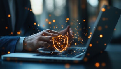 Poster - Protecting Data and Privacy with Cybersecurity Shield on Laptop in Modern Office Setting with Orange Sparkles and Blurred Background
