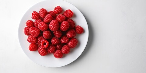 Poster - Fresh ripe raspberries arranged neatly on a white plate against a light gray background showcasing vibrant red colors for a healthy food concept.