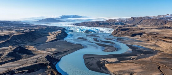 Wall Mural - Aerial view of Iceland's south coast featuring sculptural textures of a glacial river showcasing the interplay of ice and flowing water