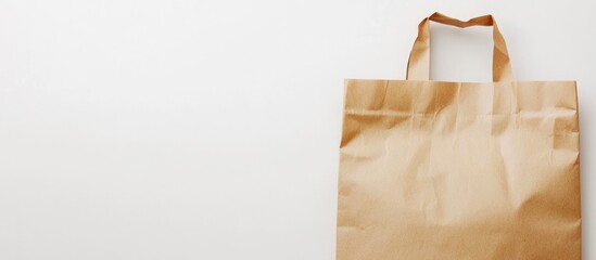 Aufkleber - Brown paper bag on white background with ample empty space for customization and text placement in advertising or design projects.