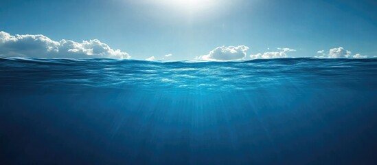 Poster - Tranquil Blue Ocean Water Surface with Sunlight and Clear Space for Text or Graphic Overlay