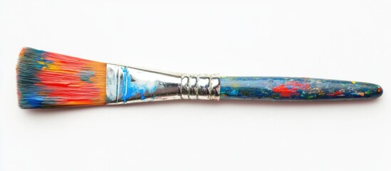 Poster - Colorful paintbrush with vibrant bristles and paint splatters isolated on a clean white background for artistic and creative concepts.