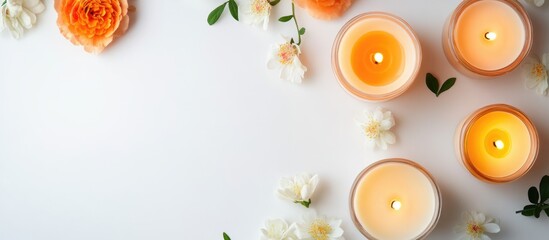 Poster - Aromatherapy candles and fresh flowers on white table Minimalist spa setting for relaxation and wellness Flat lay with blank space for text