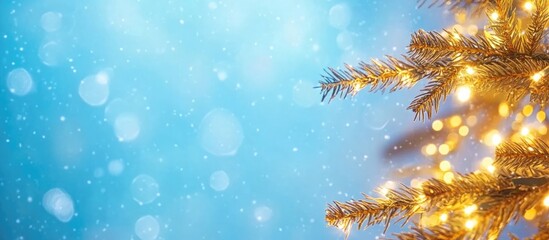 Poster - Festive bokeh background with warm fairy lights on a Christmas tree against a blue backdrop ideal for holiday-themed designs and messages