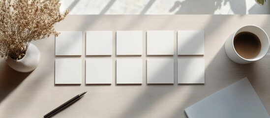 Poster - Blank business cards mockup template on a workspace with natural light coffee cup and stationery for branding and design presentations.