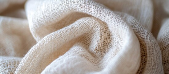Poster - Textured close-up of beige canvas fabric showcasing intricate weave patterns in a soft and elegant draped arrangement
