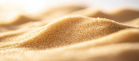 Poster - Closeup view of a soft, golden sand texture on a white background showcasing fine grains and natural patterns in a minimalist setting