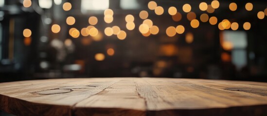 Poster - Close up of rustic wooden table with blurred bokeh lights in background creating a warm atmosphere for product display and text space