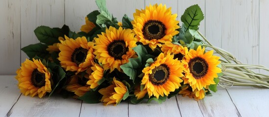 Poster - Vibrant bouquet of sunflowers beautifully arranged on a rustic white wooden background for a cheerful ambiance.