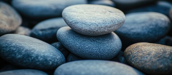 Poster - Gray stone texture close-up showcasing smooth pebbles in varying shades for use in backgrounds and design elements.