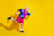 © deagreez - Full length photo of sportive cool modern pensioner dressed vintage jacket runing fast emtpy space isolated yellow color background