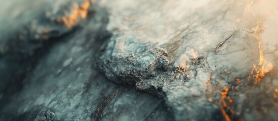 Poster - Closeup of textured marble surface featuring intricate patterns and a soft blurry background with warm lighting accents