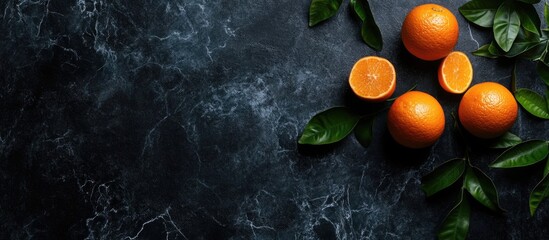 Leinwandbilder - Vibrant Citrus Fruits with Green Leaves on Dark Stone Background Ideal for Freshness and Healthy Eating Promotions