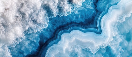 Poster - Translucent agate stone slice with natural concentric patterns and vibrant blue textures perfect for backgrounds and design elements.