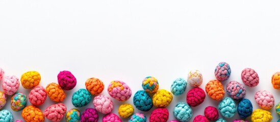 Poster - Vibrant Easter eggs arranged in a flat lay composition on a pristine white background for festive celebration and spring-themed designs.