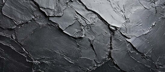Poster - Textured surfaces of charcoal with intricate details and shades of black for artistic or design backgrounds.